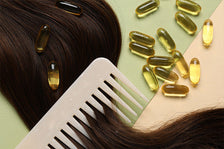 Collagen capsules, hair lock and comb on color background
