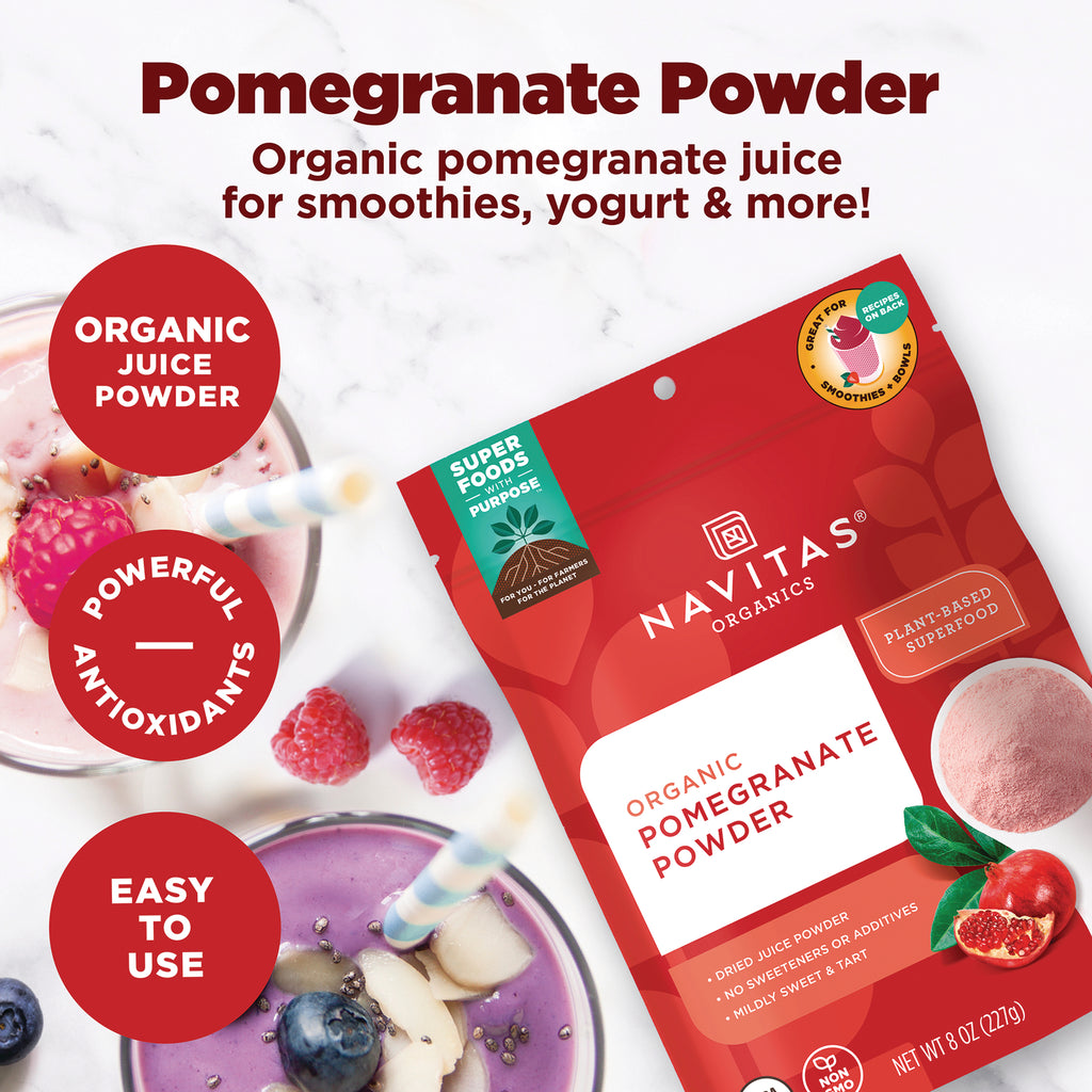NAV023 | Red Navitas Organics pouch of organic pomegranate powder next to smoothies and raspberries - Thumbnail