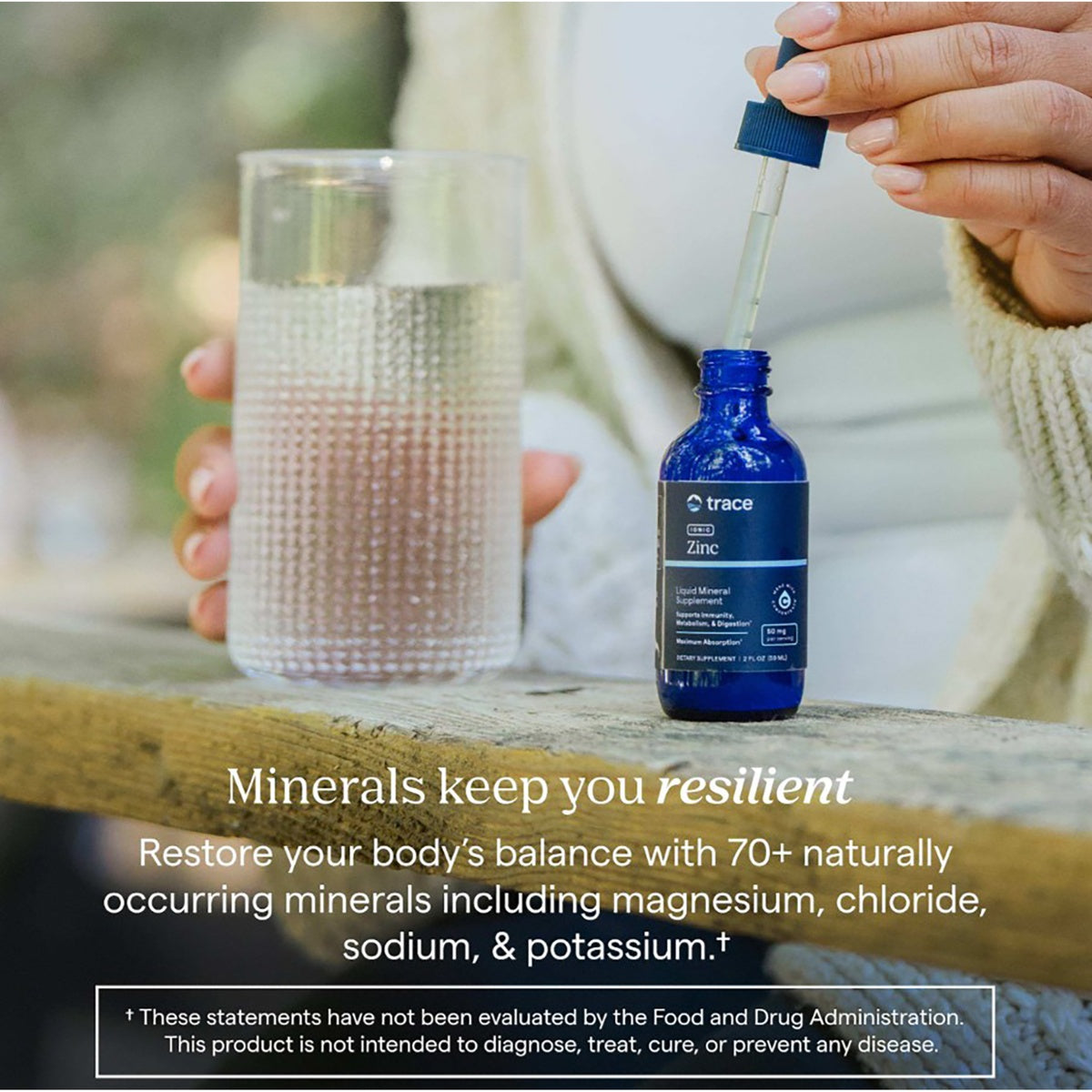 TM027 | Trace Zinc liquid mineral supplement beside a glass as a dropper adds liquid, with mineral balance messaging