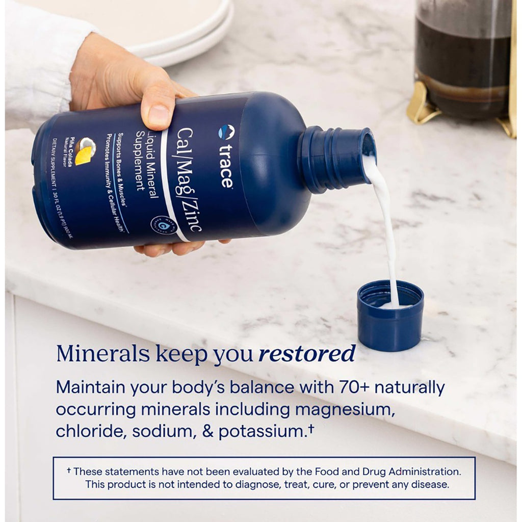 TM016 | trace Cal/Mag/Zinc liquid mineral supplement pouring into a cap with minerals keep you restored text - Thumbnail
