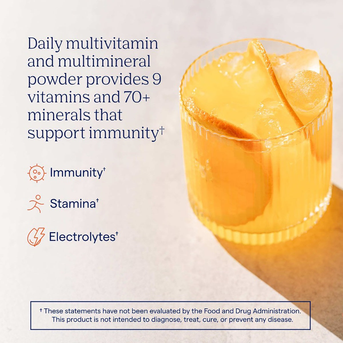 TM070 | Daily multivitamin powder in a glass with citrus, highlighting immunity, stamina, and electrolytes
