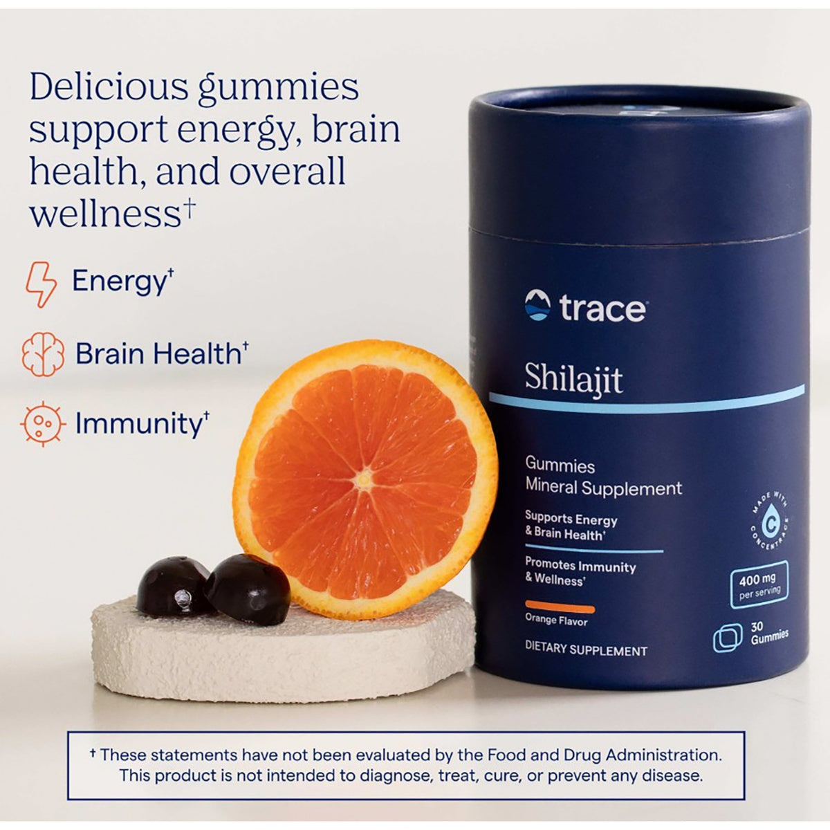TM164 | Trace Shilajit gummies supplement with orange slice and benefit callouts for energy, brain health, and immunity