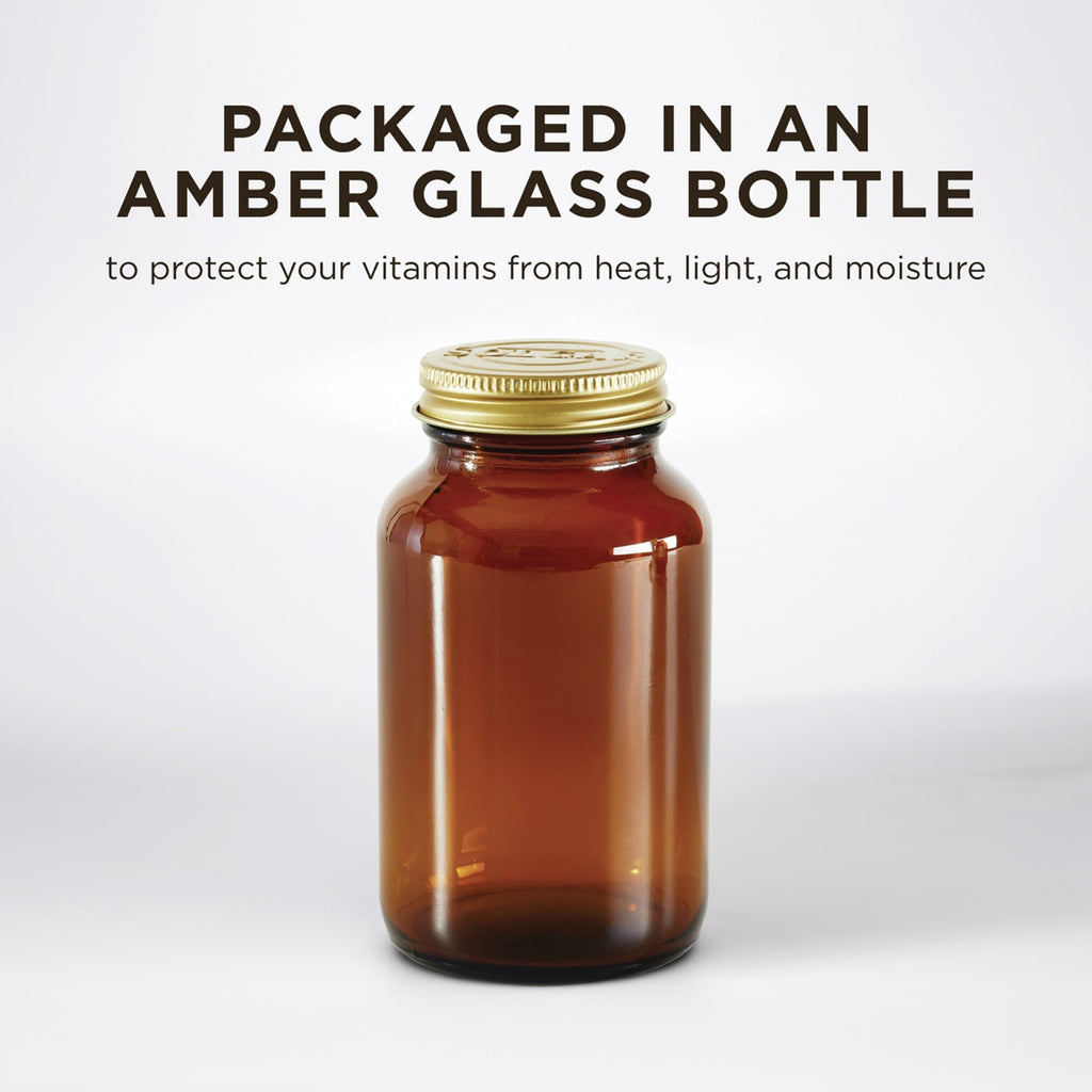 SLG383 | Amber glass bottle with gold cap and text about protecting vitamins from heat, light, and moisture - Thumbnail