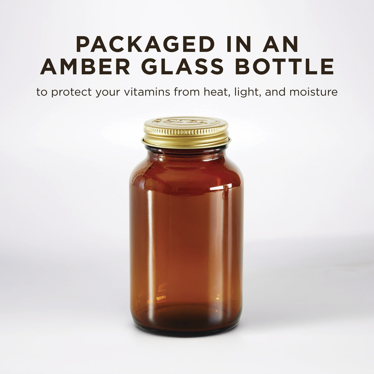 SLG383 | Amber glass bottle with gold cap and text about protecting vitamins from heat, light, and moisture