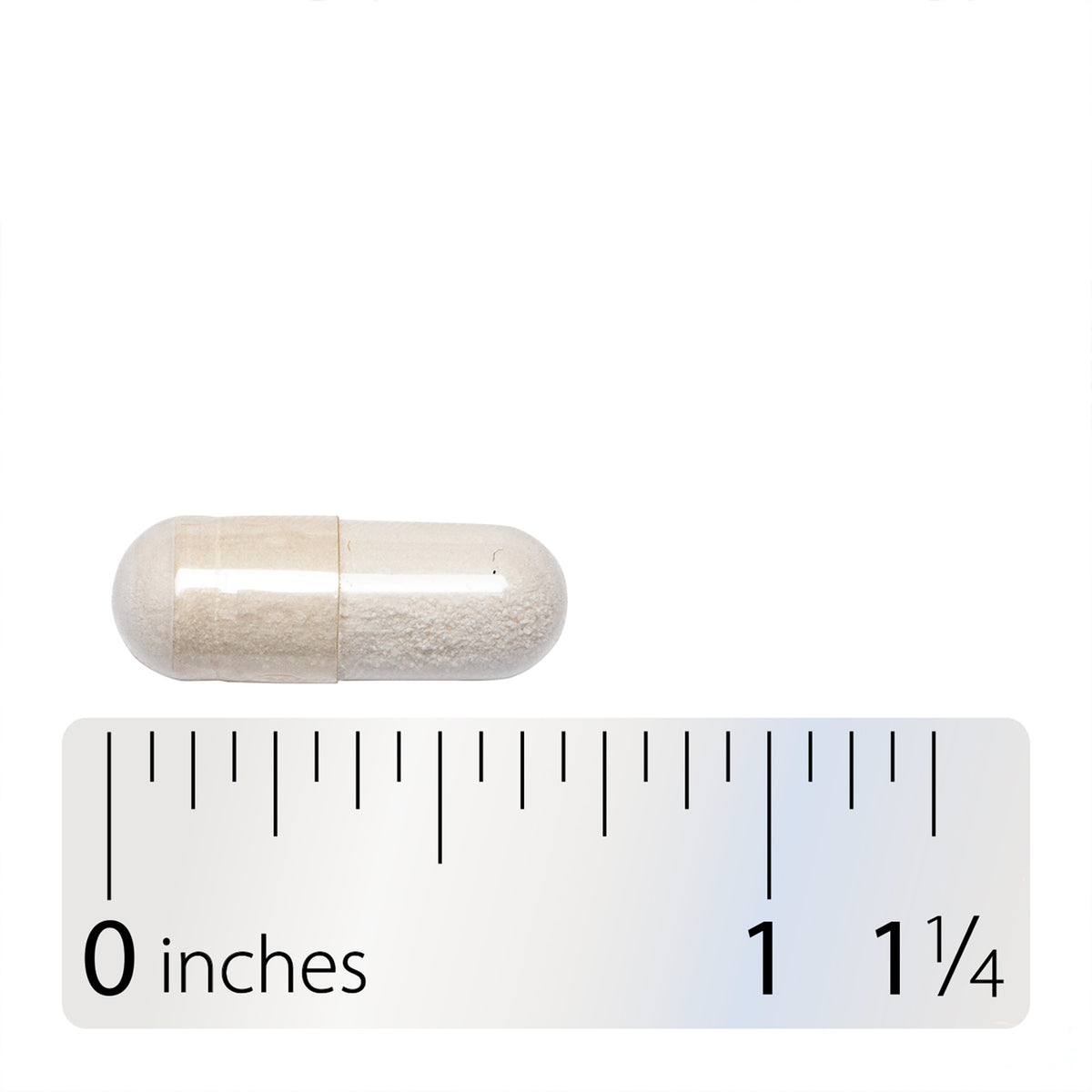 ET438 | Beige capsule shown above a ruler for size reference