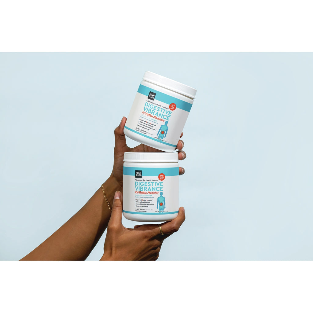 VH042 | Hands holding two Vibrant Health Digestive Vibrance probiotic tubs, one stacked on the other - Thumbnail