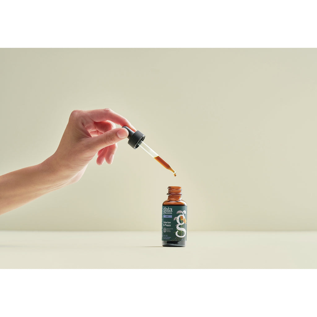 GH179 | Hand using dropper above Gaia Herbs Valerian & Poppy bottle - Thumbnail