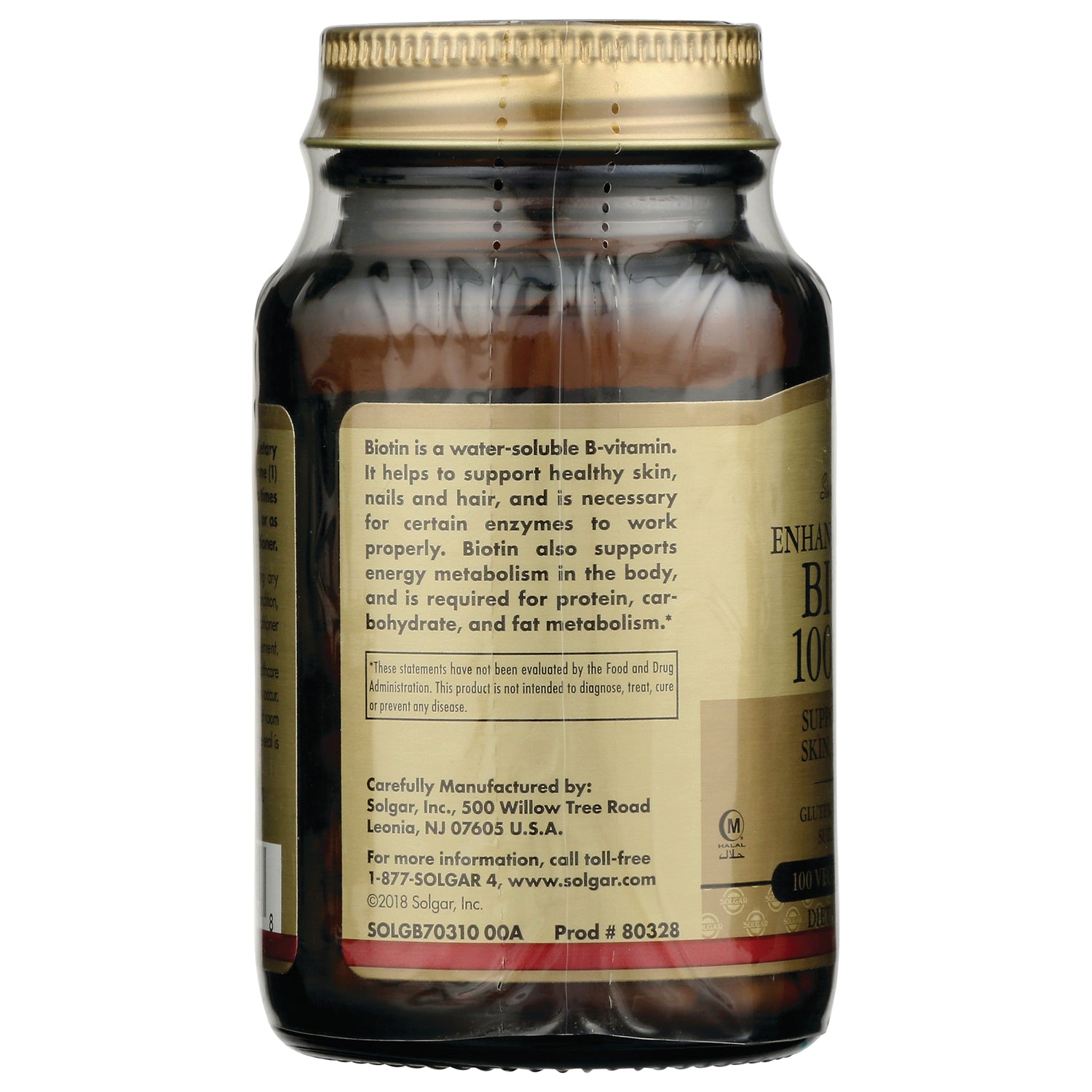 Brown glass supplement bottle back label with biotin benefits text, manufacturing details, and product codes