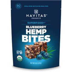 NAV042 | Navitas Organics Superfood+ Blueberry Hemp Bites front pouch with bowl of bite-size snacks and blueberries