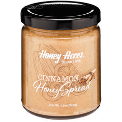 HAC002 | Glass jar of Honey Acres cinnamon honey spread with black lid labeled CINNAMON Honey Spread 12oz (340g)