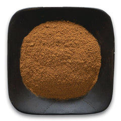 FNP069 | heap of brown ground powder in a black square dish