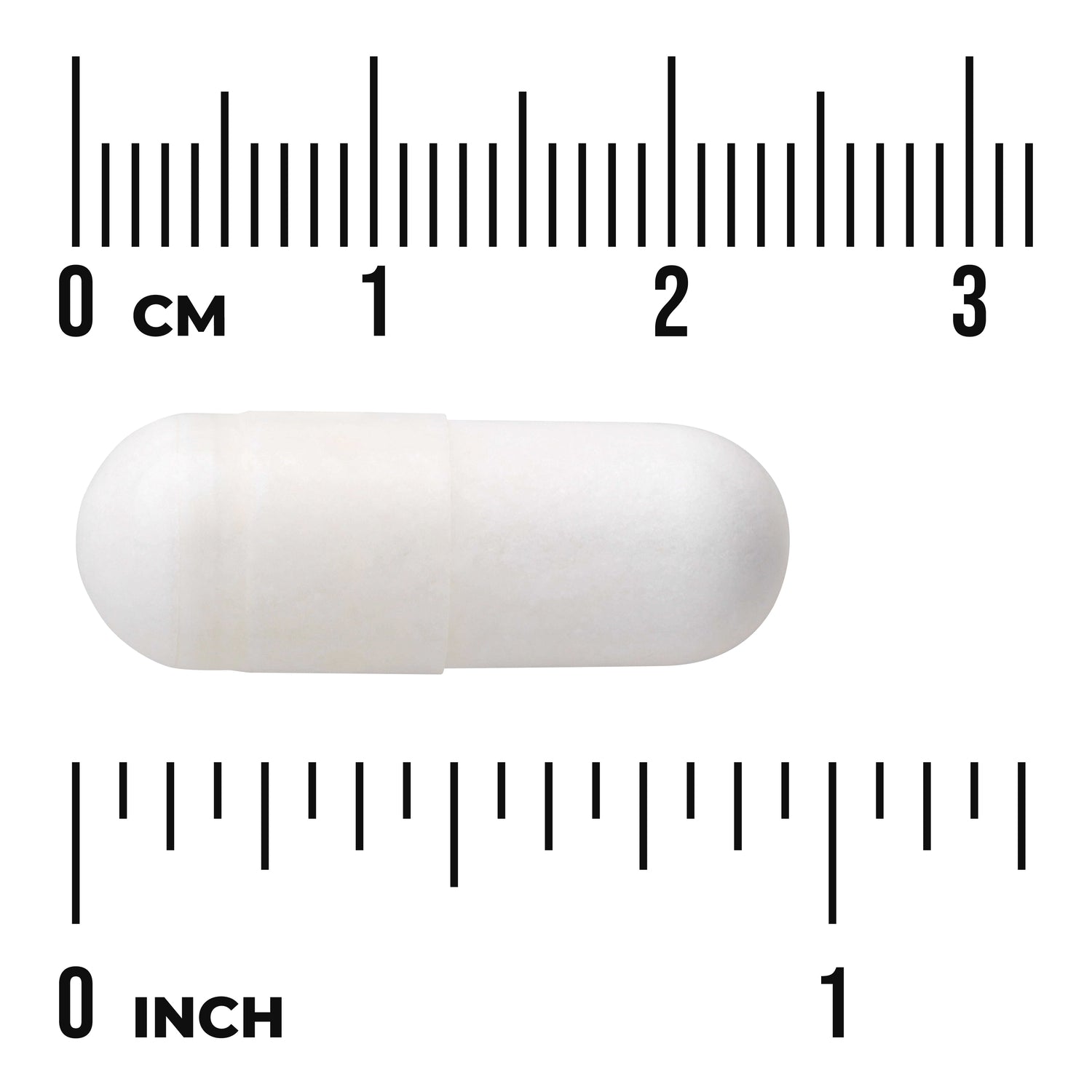 SW1121 | White capsule shown against cm and inch ruler for size