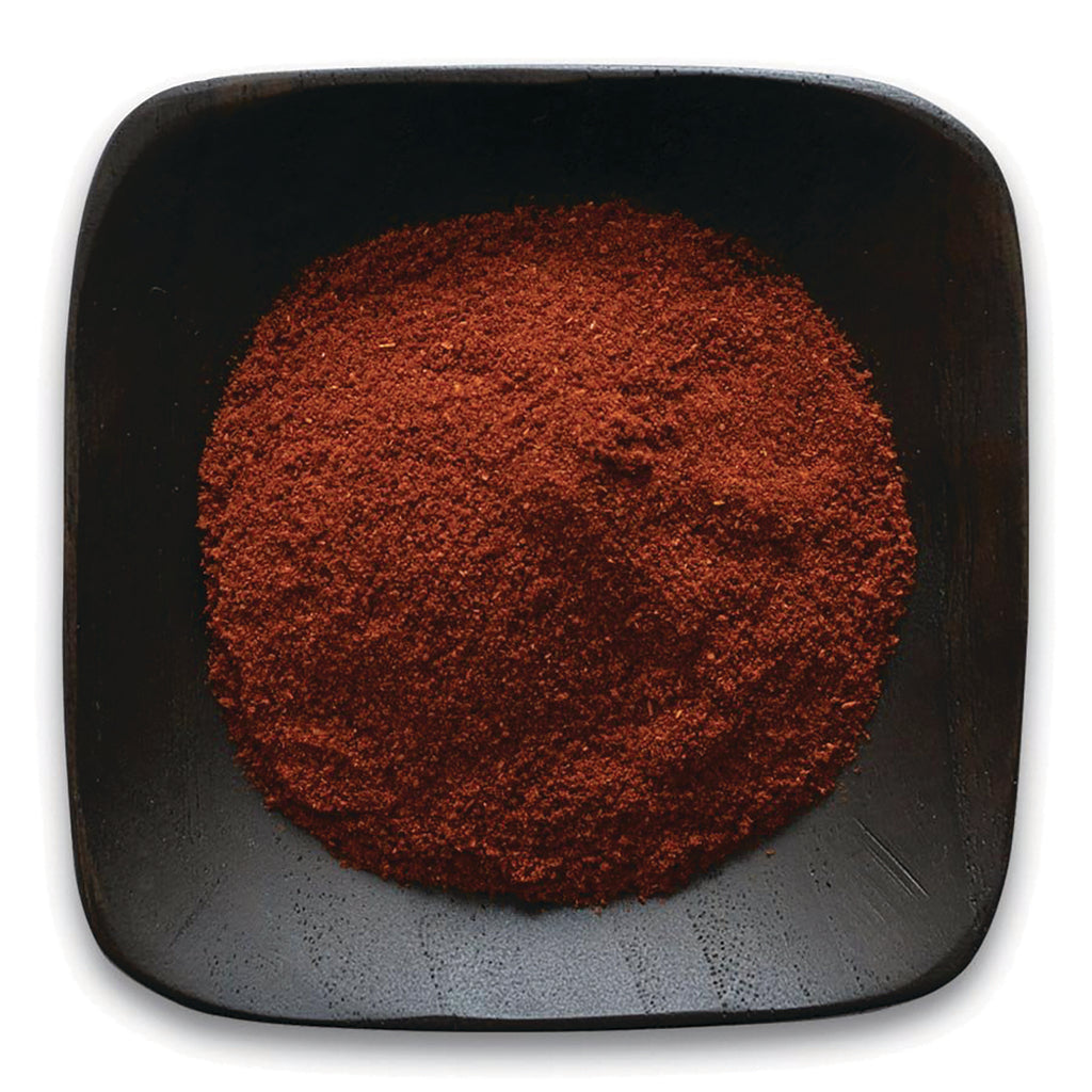 FNP070 | ground red spice powder heaped in a black square dish - Thumbnail