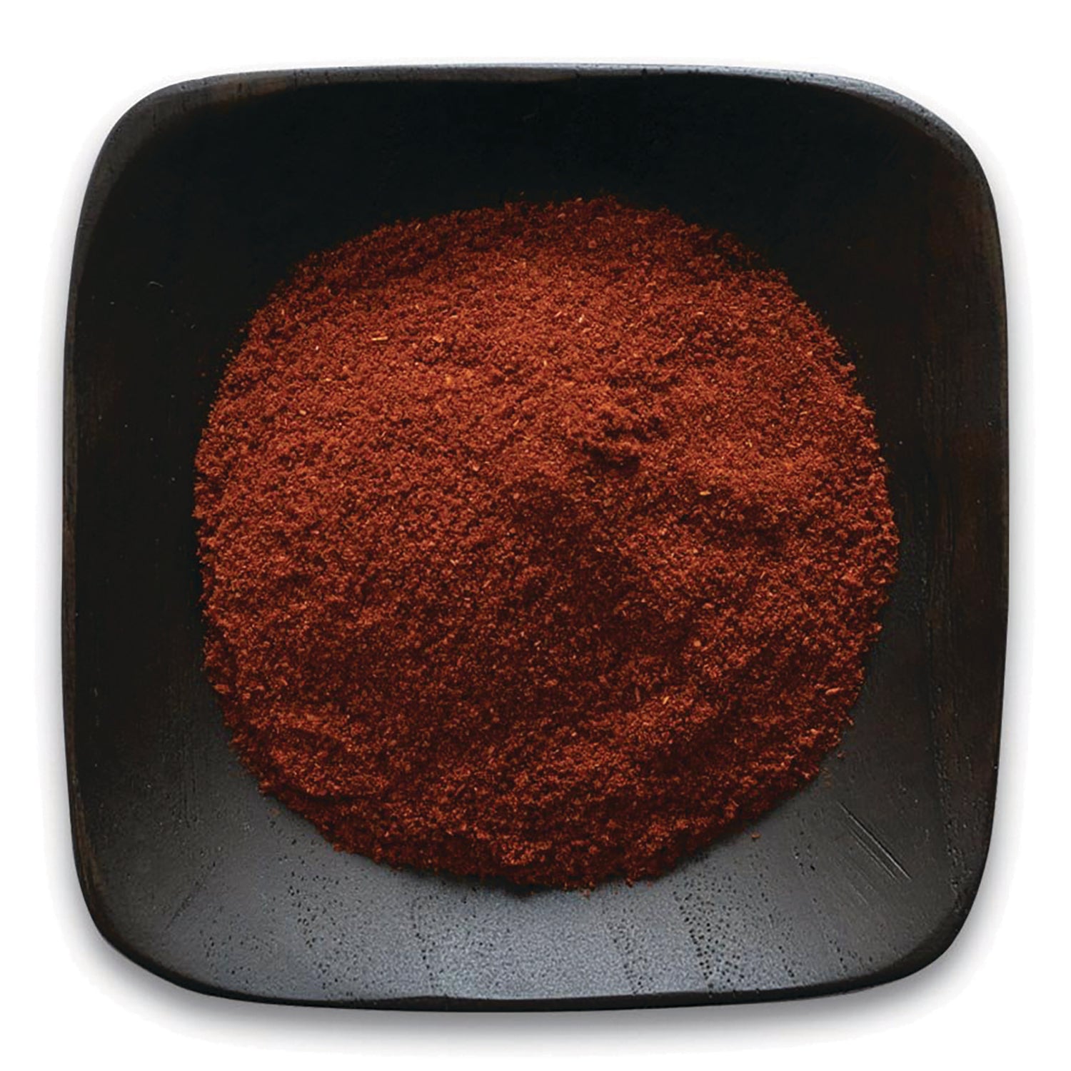 FNP070 | ground red spice powder heaped in a black square dish