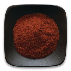 FNP070 | ground red spice powder heaped in a black square dish