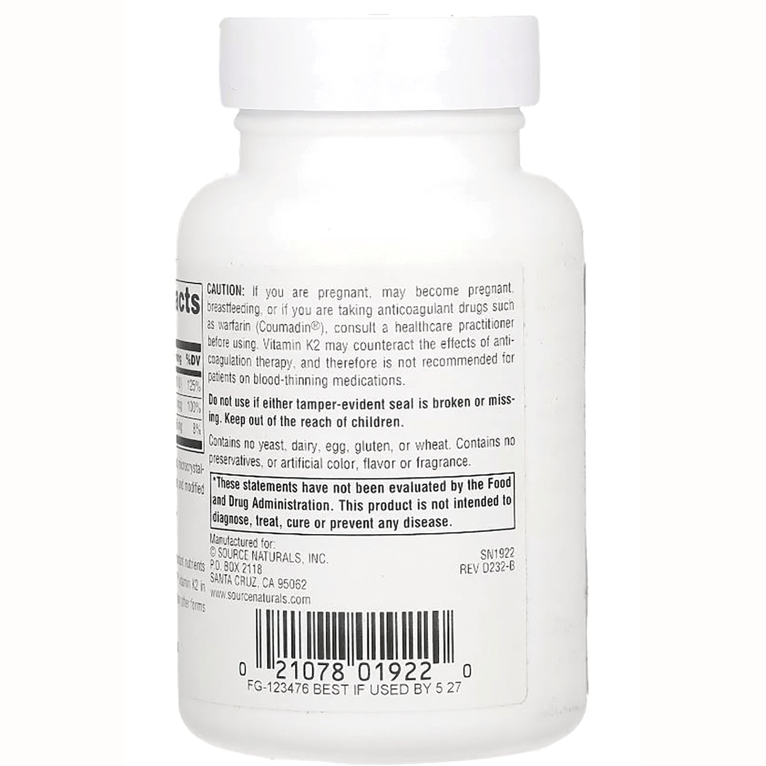 SN142 | back label of white supplement bottle showing caution text, barcode, and manufacturing information