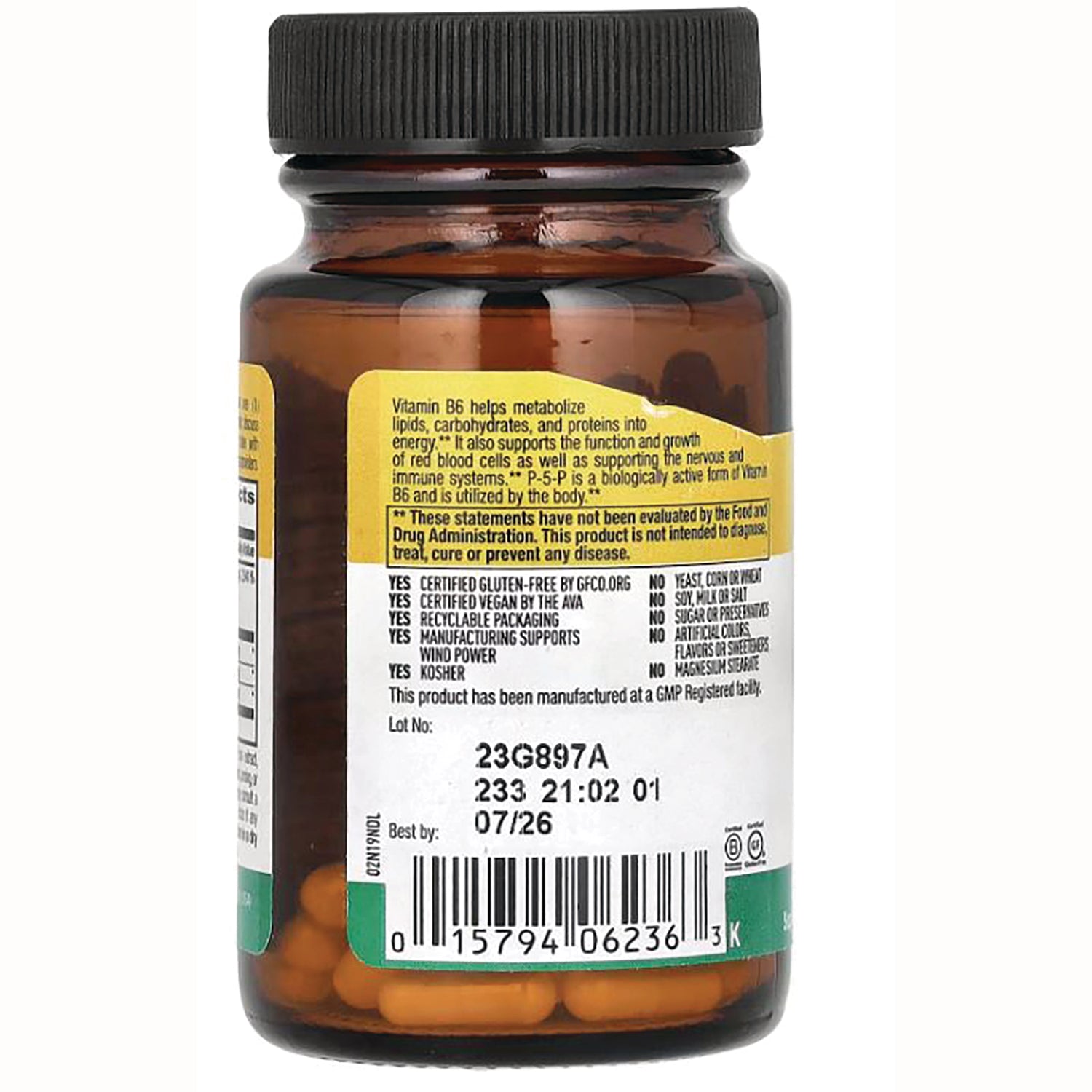 CRL561 | brown glass supplement bottle back showing ingredient panel, barcode, lot number and orange capsules