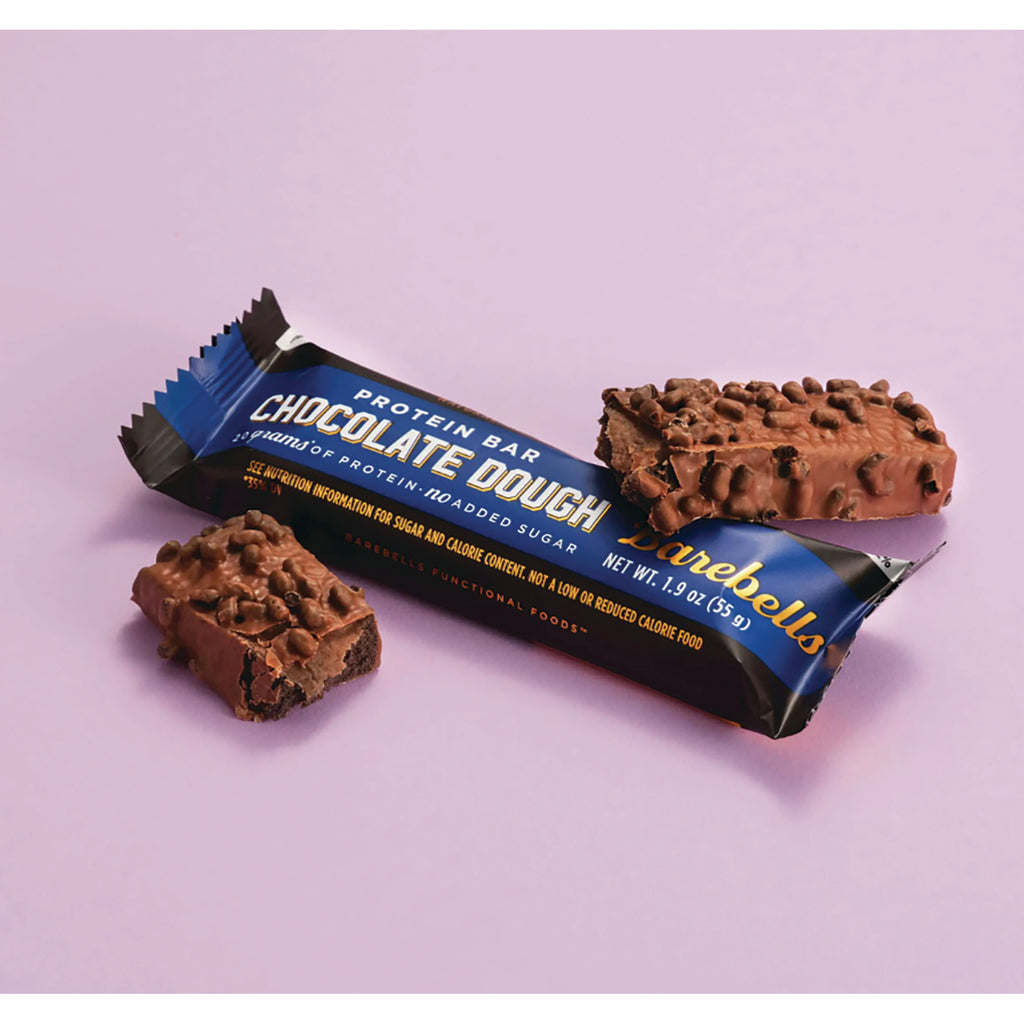 BAE002 | Chocolate Dough protein bar in blue wrapper with two chocolate-coated bars and a broken piece on pink background - Thumbnail