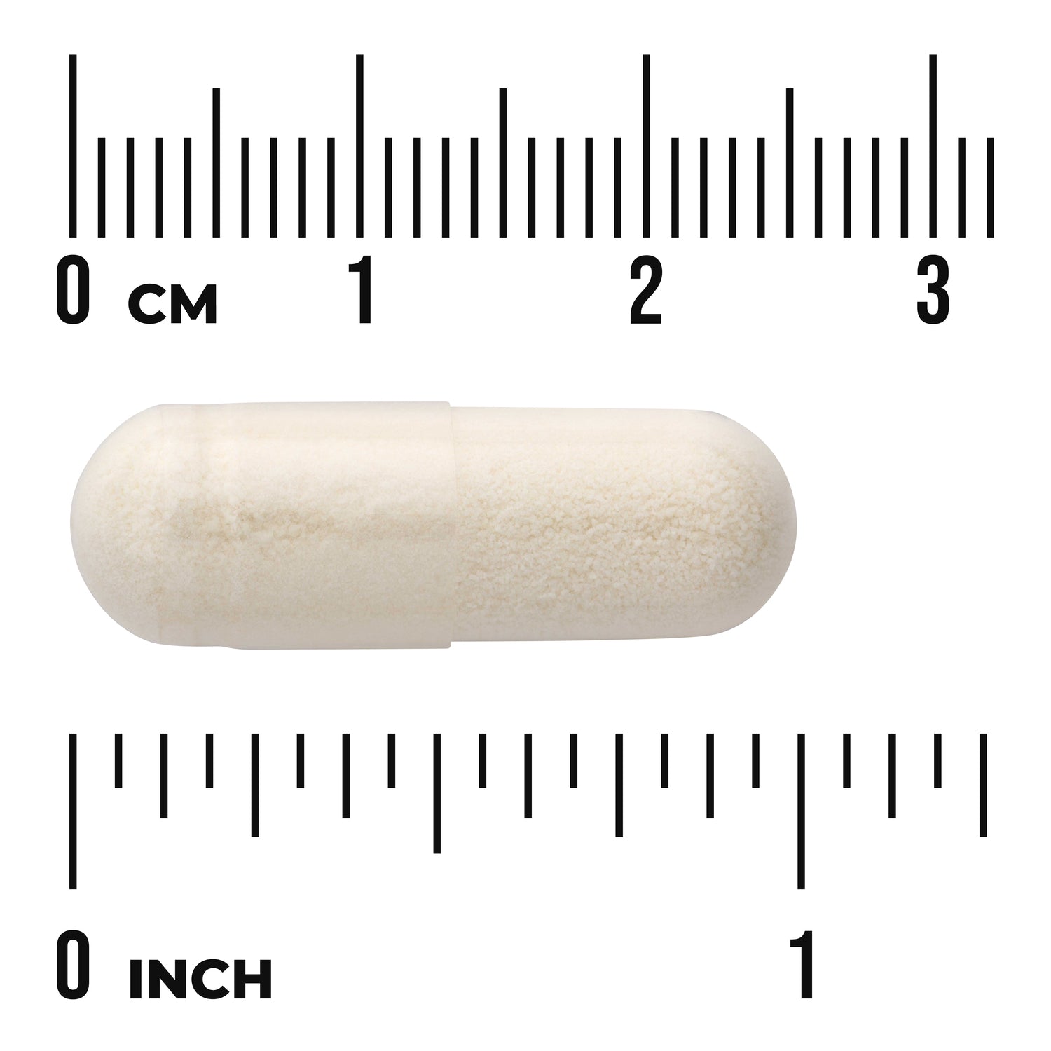 SWU149 | White capsule filled with powder centered on ruler showing centimeters and inches