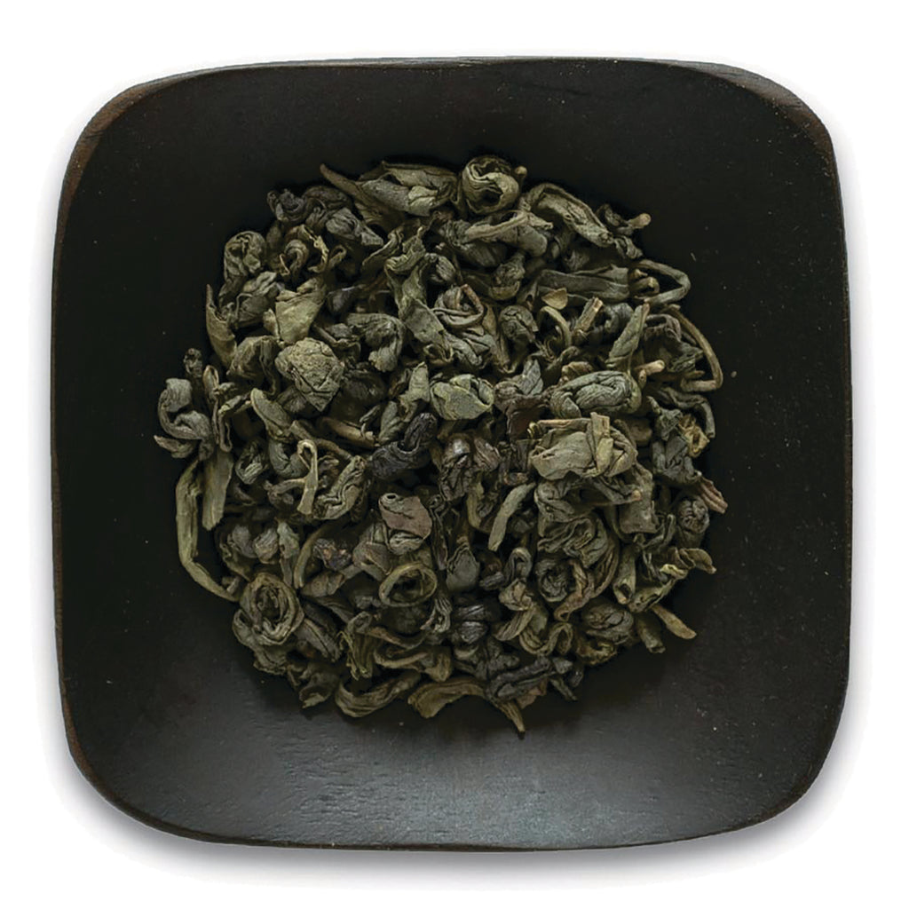 FNP031 | rolled green tea leaves in a dark square dish on white background - Thumbnail