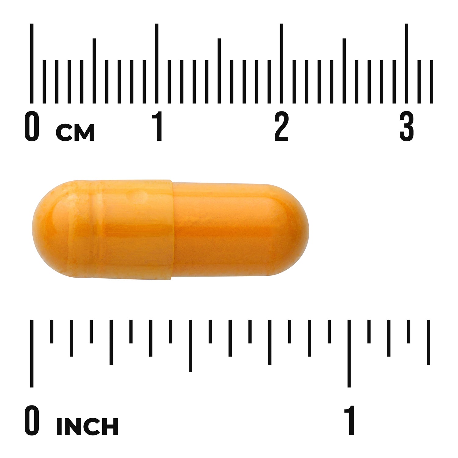 SWH284 | Orange capsule displayed next to centimeter and inch rulers to show size