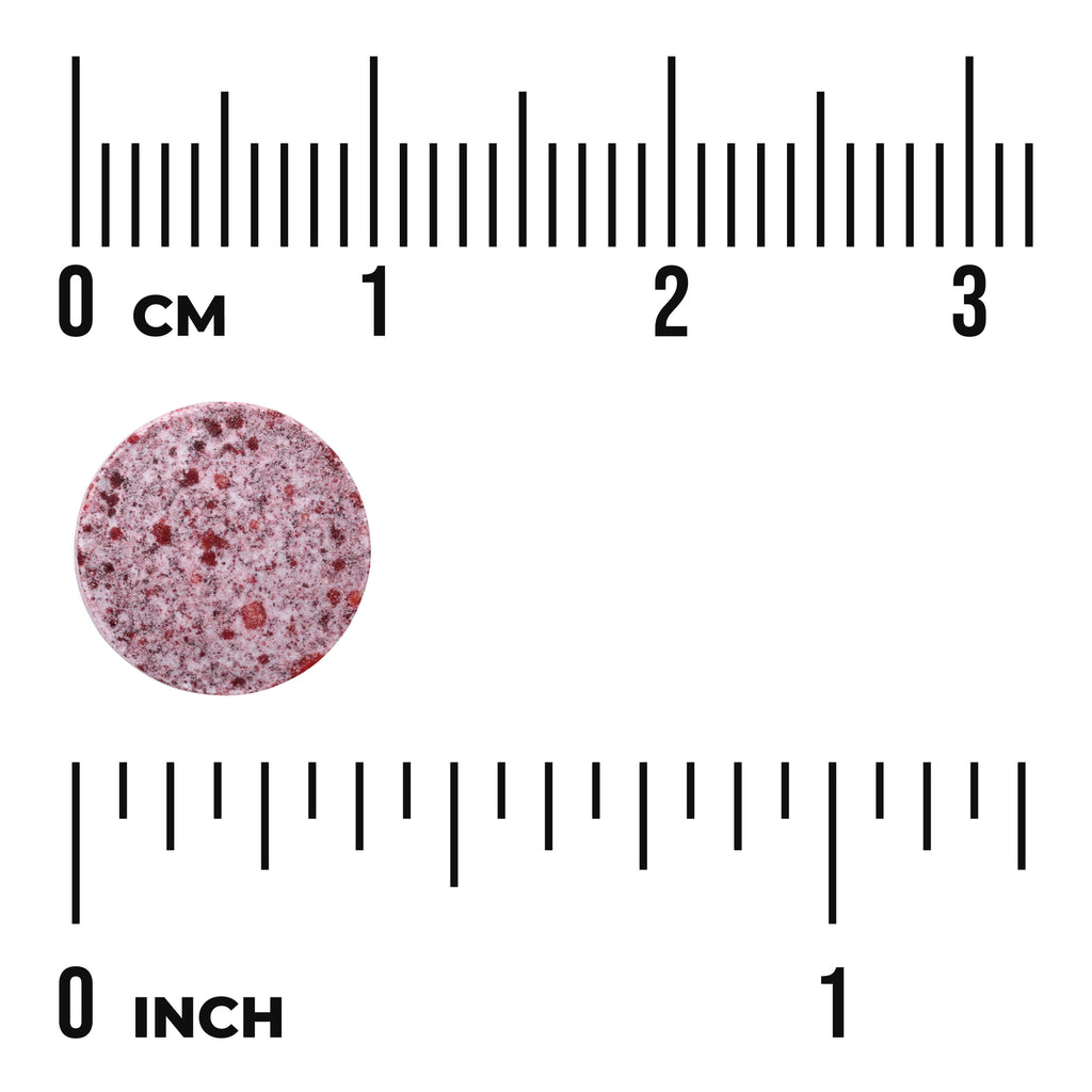 SWU783 | Round speckled red tablet next to centimeter and inch rulers, about 1 cm diameter - Thumbnail