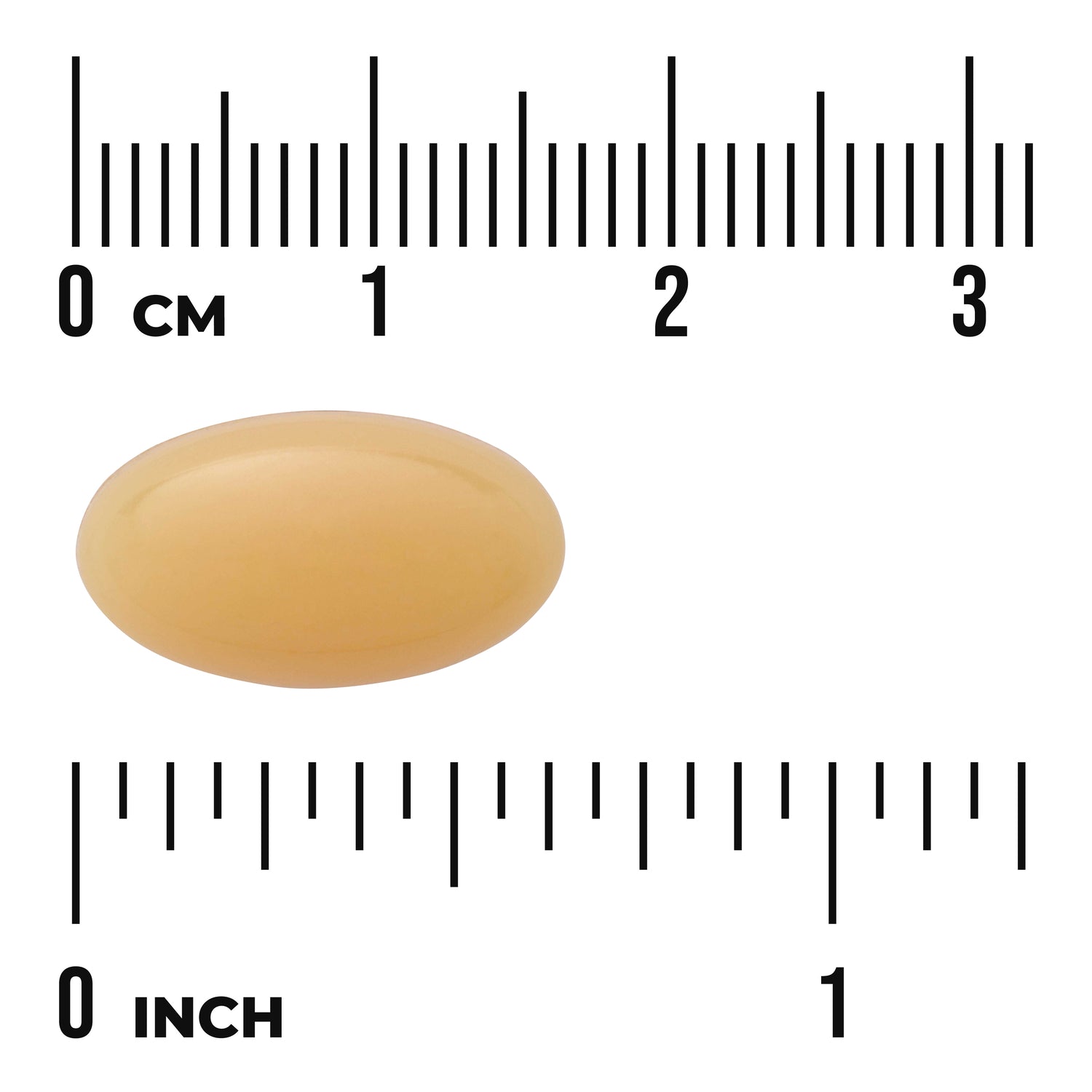 SWU125 | Amber softgel capsule on centimeter and inch rulers, about 2.5 cm long
