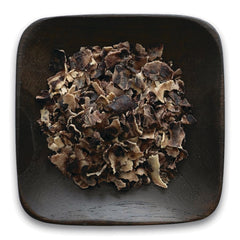 FNP389 | dark wooden square bowl filled with dried brown mushroom flakes