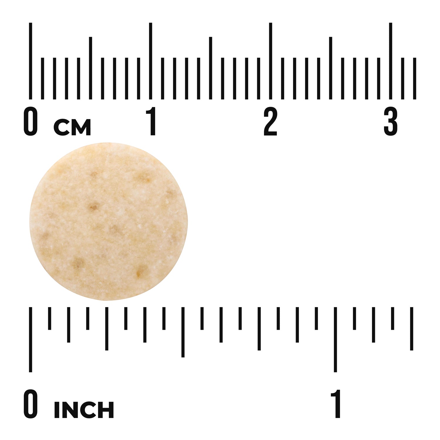 SWU841 | Beige round tablet next to rulers marked "0 cm" and "0 inch" showing size