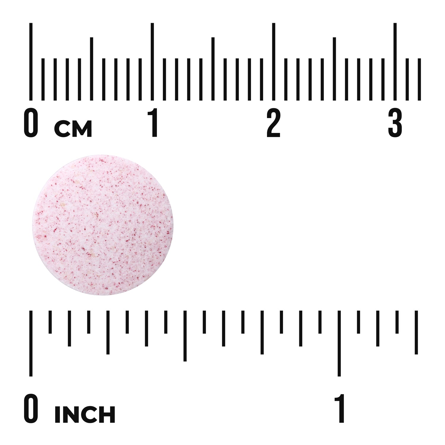 SWA035 | Round pink speckled tablet next to centimeter and inch rulers showing size scale