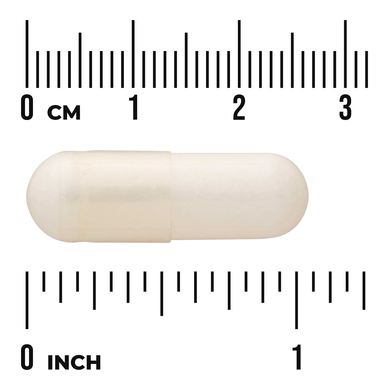 SWU798 | White capsule displayed with centimeter and inch rulers indicating length about 2.5 cm