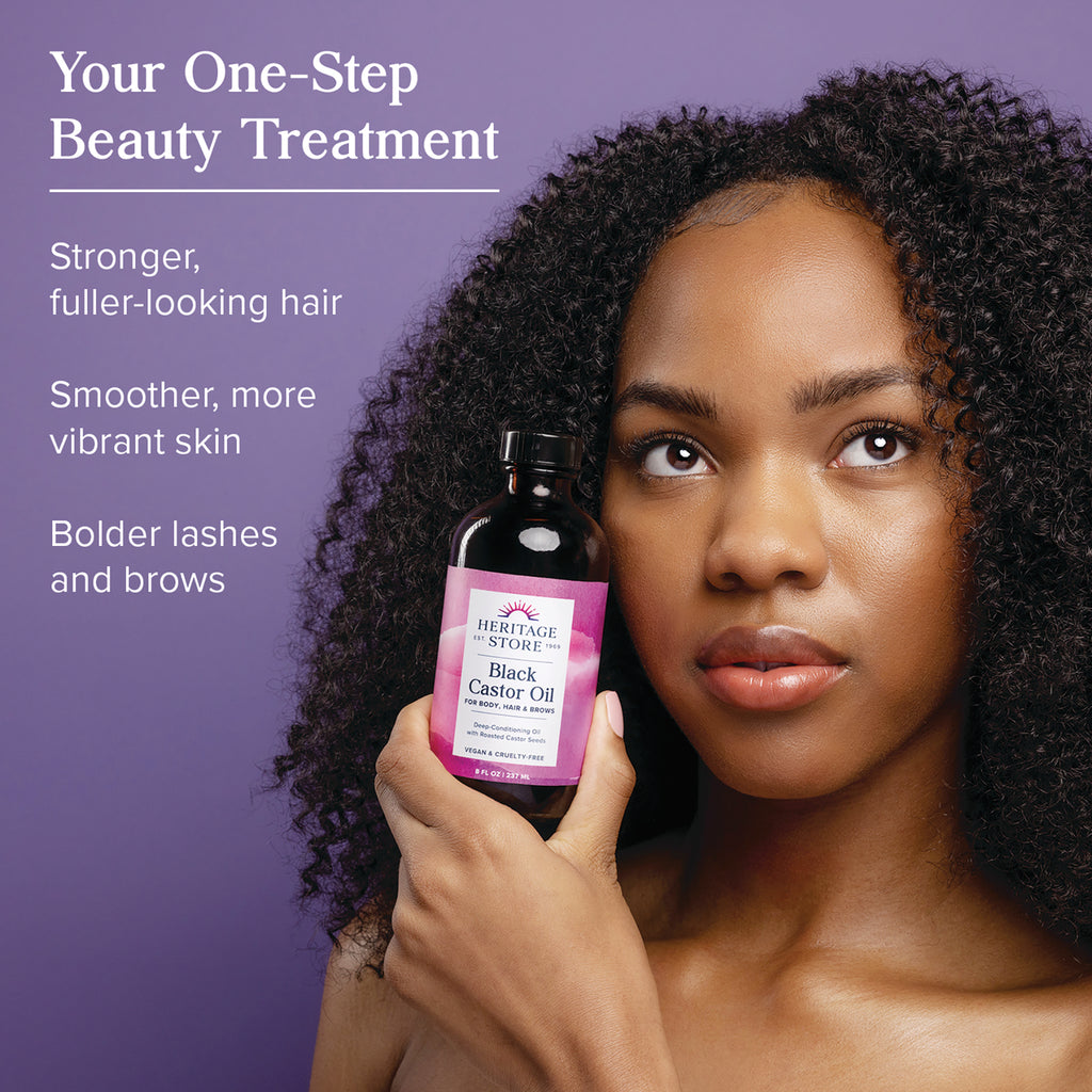 HTG104 | Woman holding Heritage Store Black Castor Oil bottle with overlay text touting stronger fuller hair and bolder lashes and brows - Thumbnail