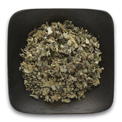 FNP384 | dried herbal leaves in a black square dish, top-down view
