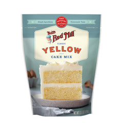 BOB481 | Bob's Red Mill Yellow Cake Mix pouch with two-layer frosted cake slice on a plate