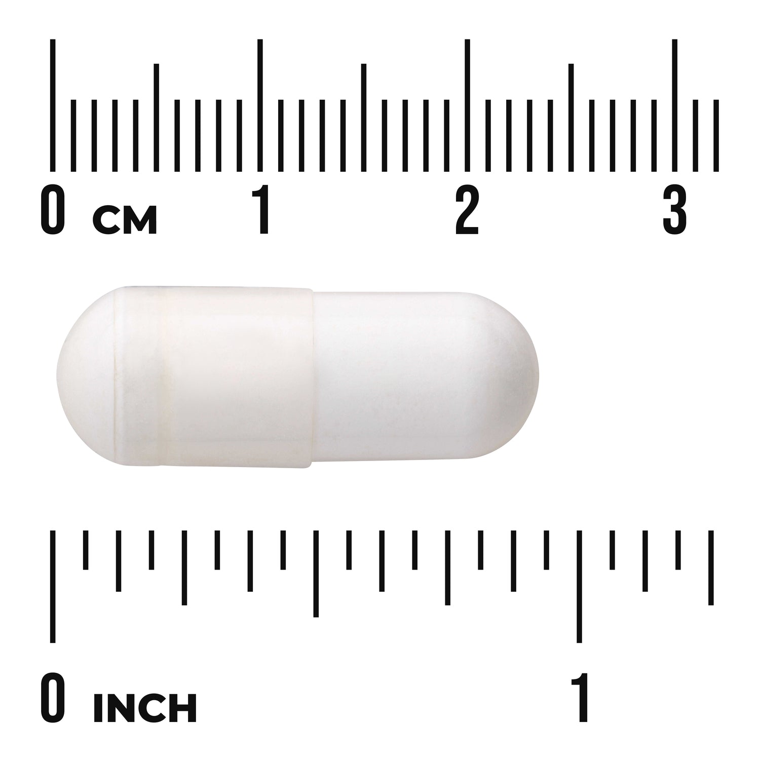 SWU946 | White capsule next to centimeter and inch rulers labeled 0 CM and 0 INCH