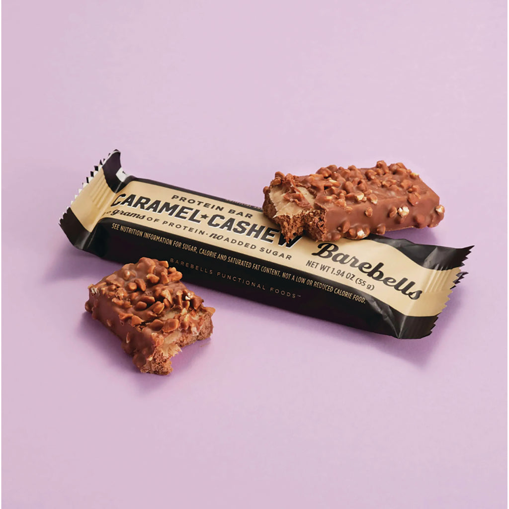 BAE001 | Caramel Cashew protein bar and two bitten pieces on pale purple background - Thumbnail
