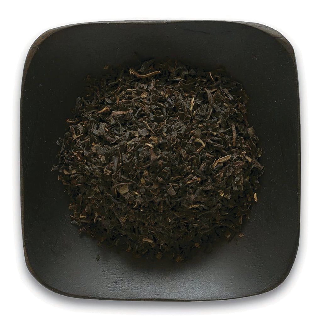 FNP027 | loose black tea leaves piled on a square dark plate - Thumbnail