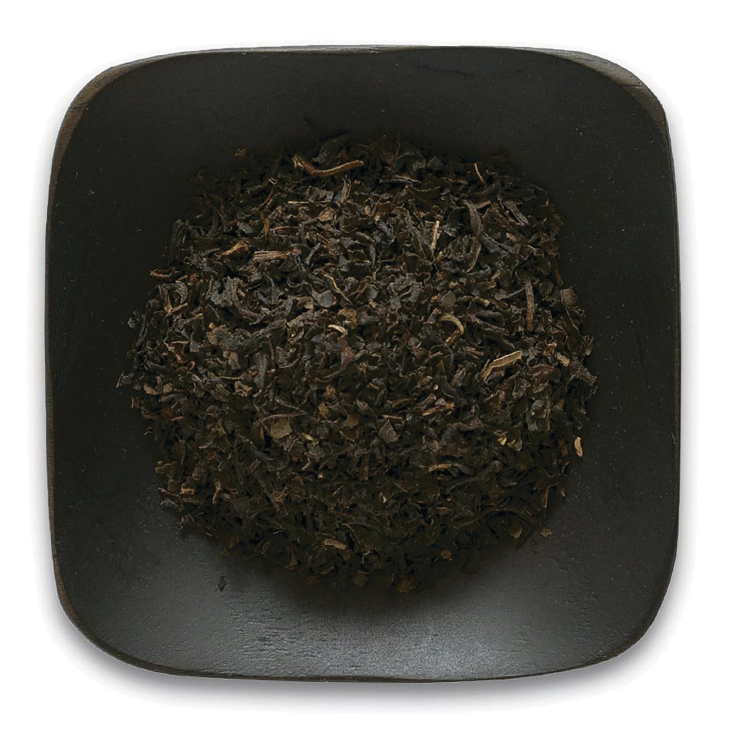 FNP027 | loose black tea leaves piled on a square dark plate