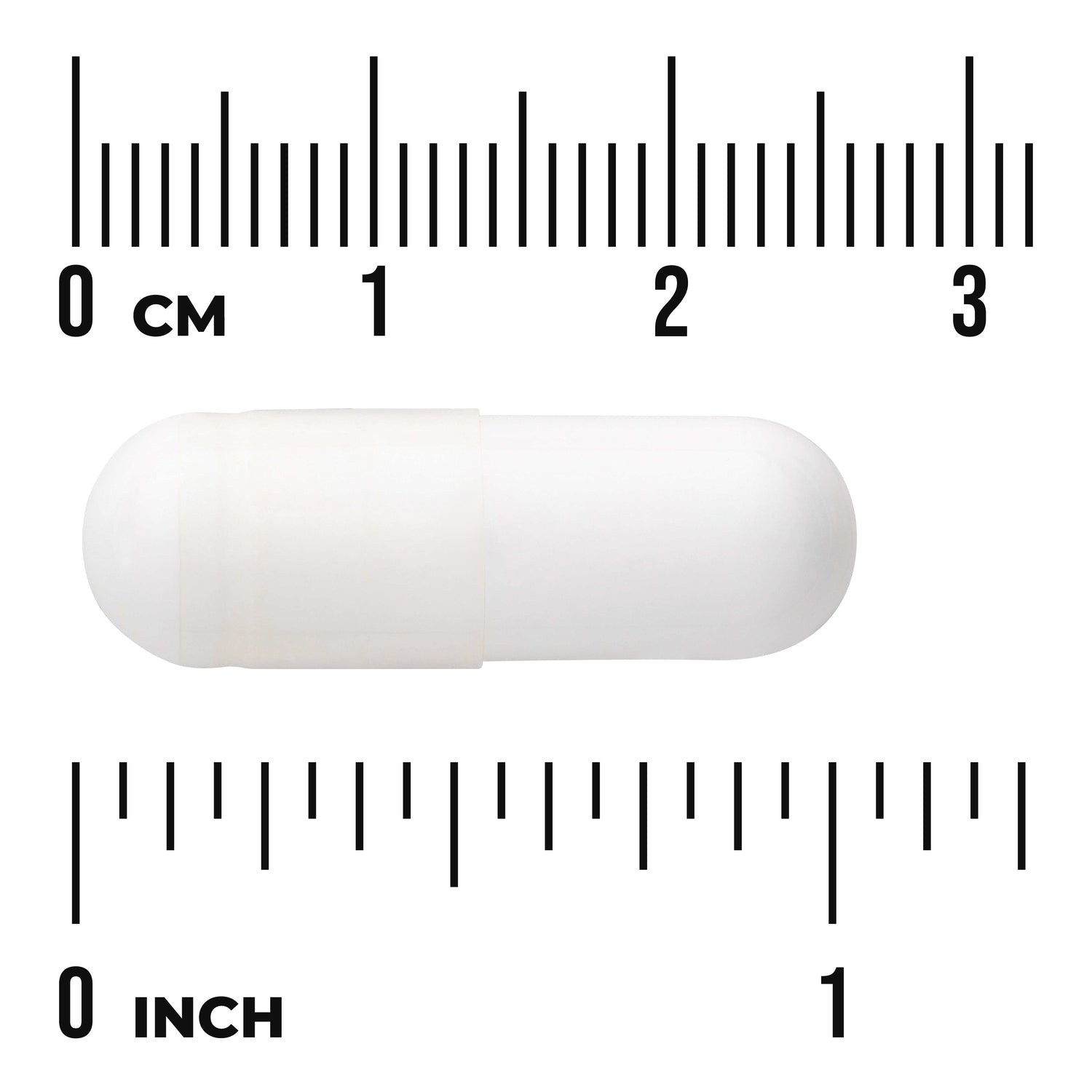 SW039 | White gelatin capsule centered between centimeter and inch rulers labeled "0 CM" and "0 INCH"