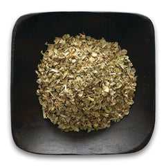 FNP072 | dried oregano flakes in a dark square wooden bowl