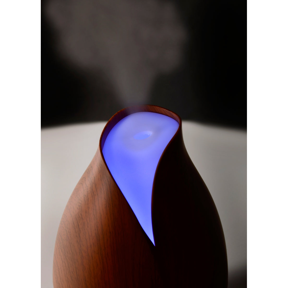 NWF1233 | dark wood ultrasonic diffuser with blue LED glow and mist rising