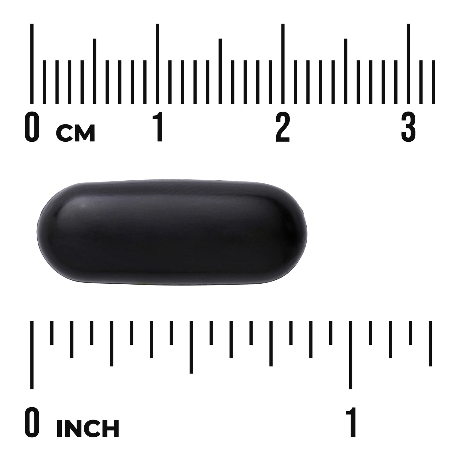 SW1857 | Black oblong softgel capsule on centimeter and inch rulers showing '0 cm' and '0 inch' markings