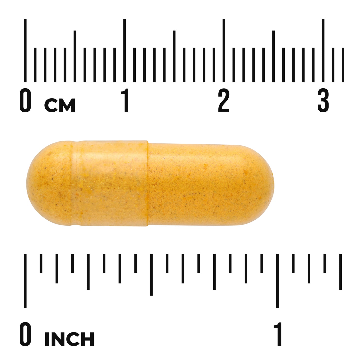 SWC053 | yellow capsule pill on white background with centimeter and inch rulers showing size