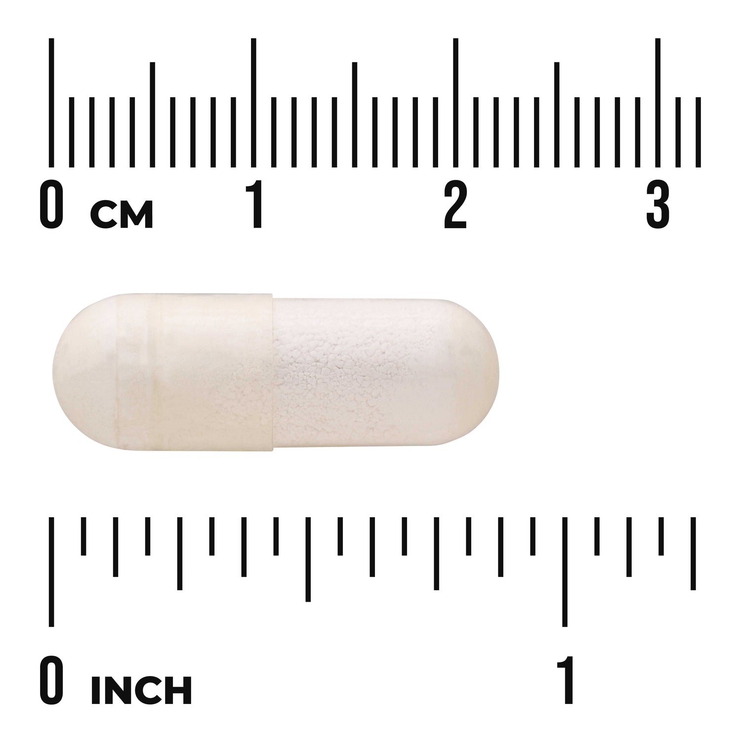 SW1243 | White capsule on centimeter and inch rulers showing approx 2 cm length