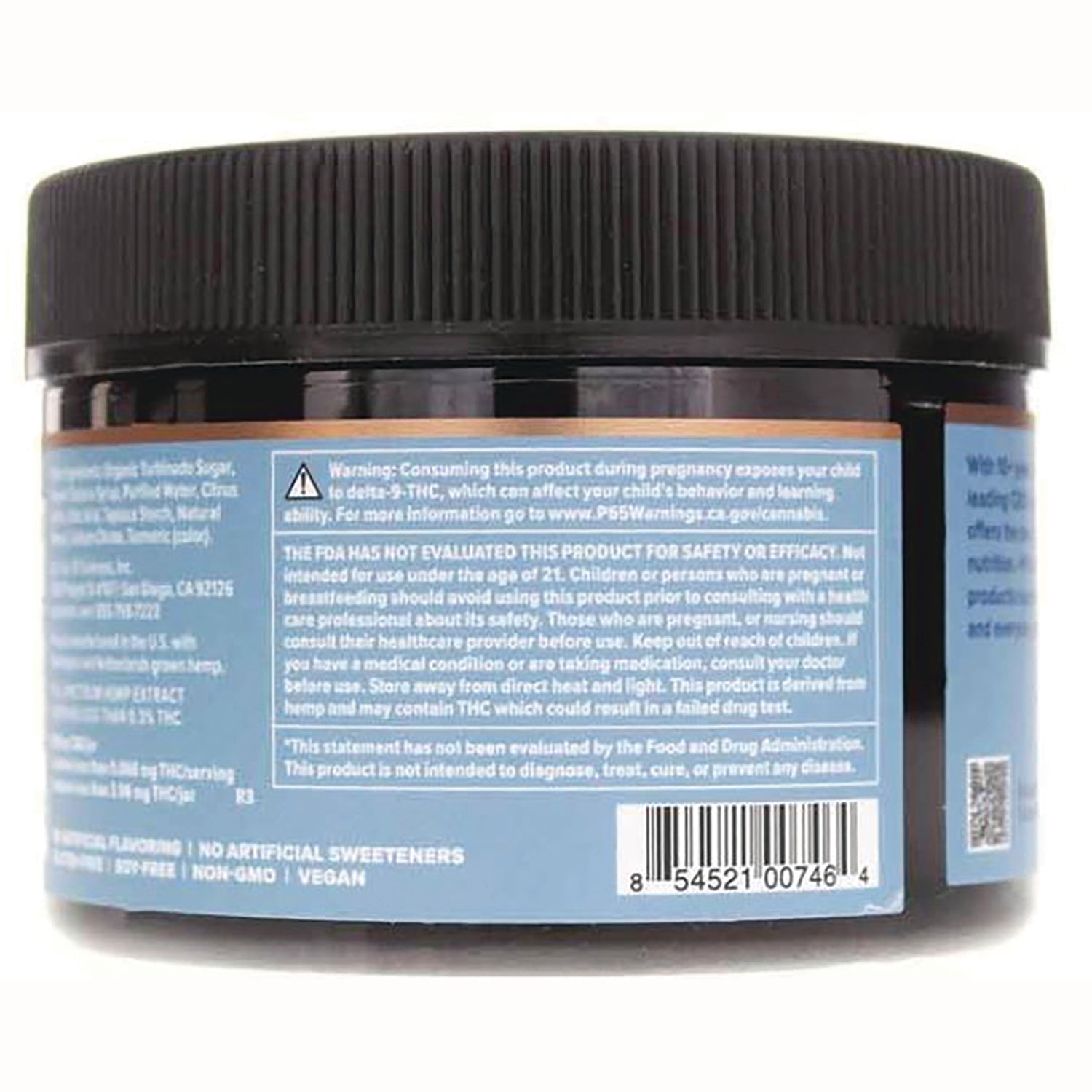 CV024 | back of dark plastic jar with blue label showing warning text, ingredient panel, and barcode