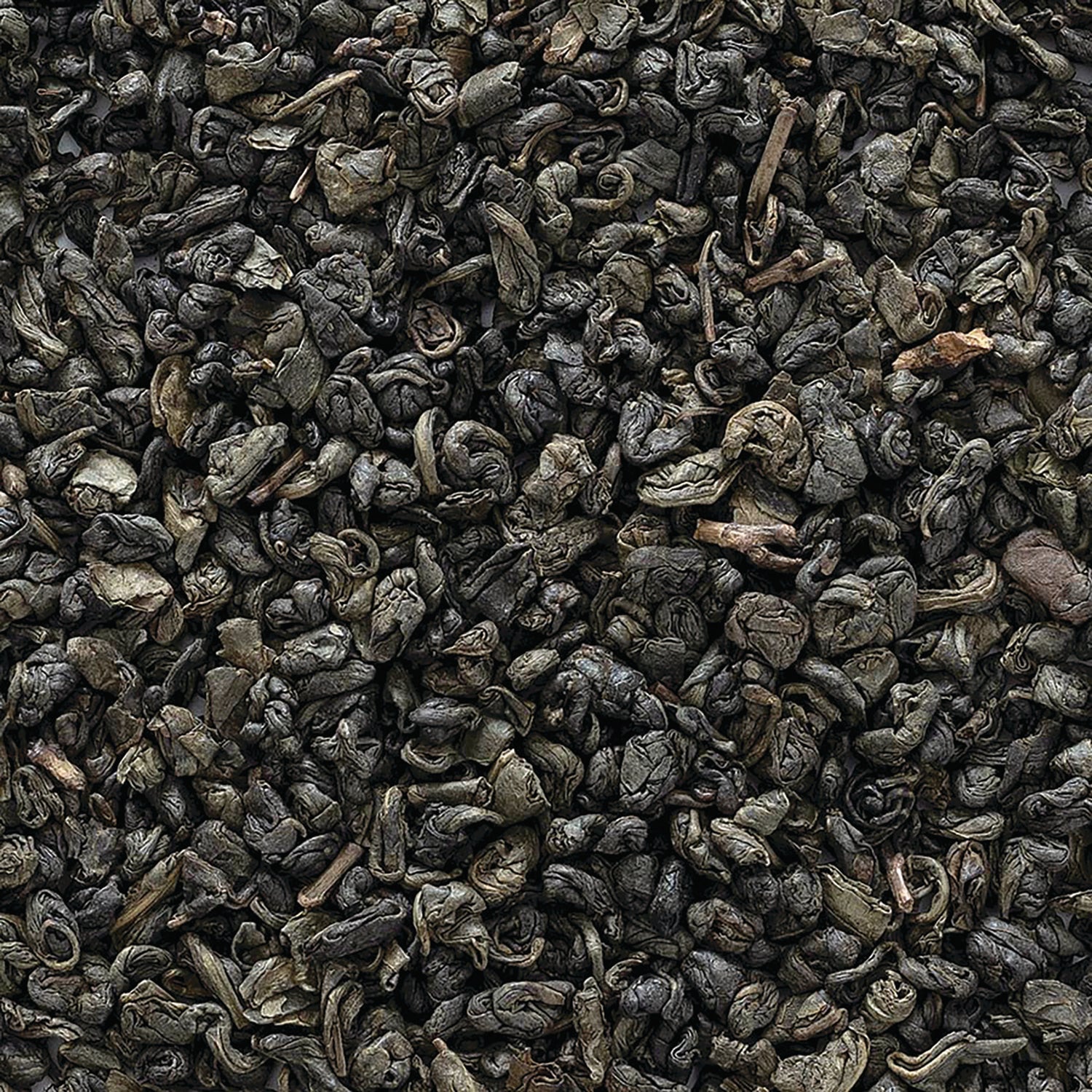 FNP082 | Close-up of rolled dark green loose tea leaves showing curled gunpowder-style leaves