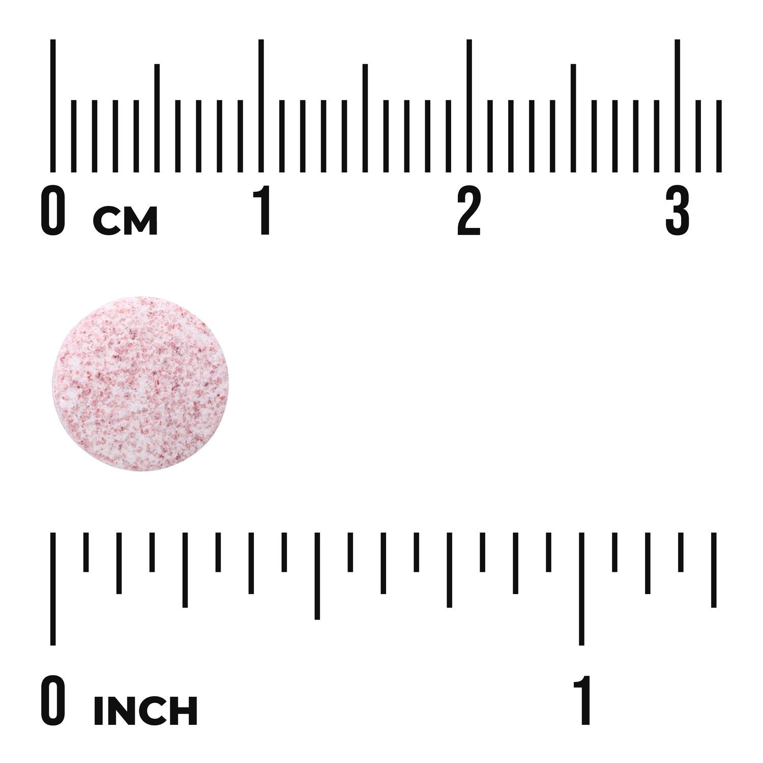 SWU907 | Pink speckled round tablet beside centimeter and inch rulers showing scale