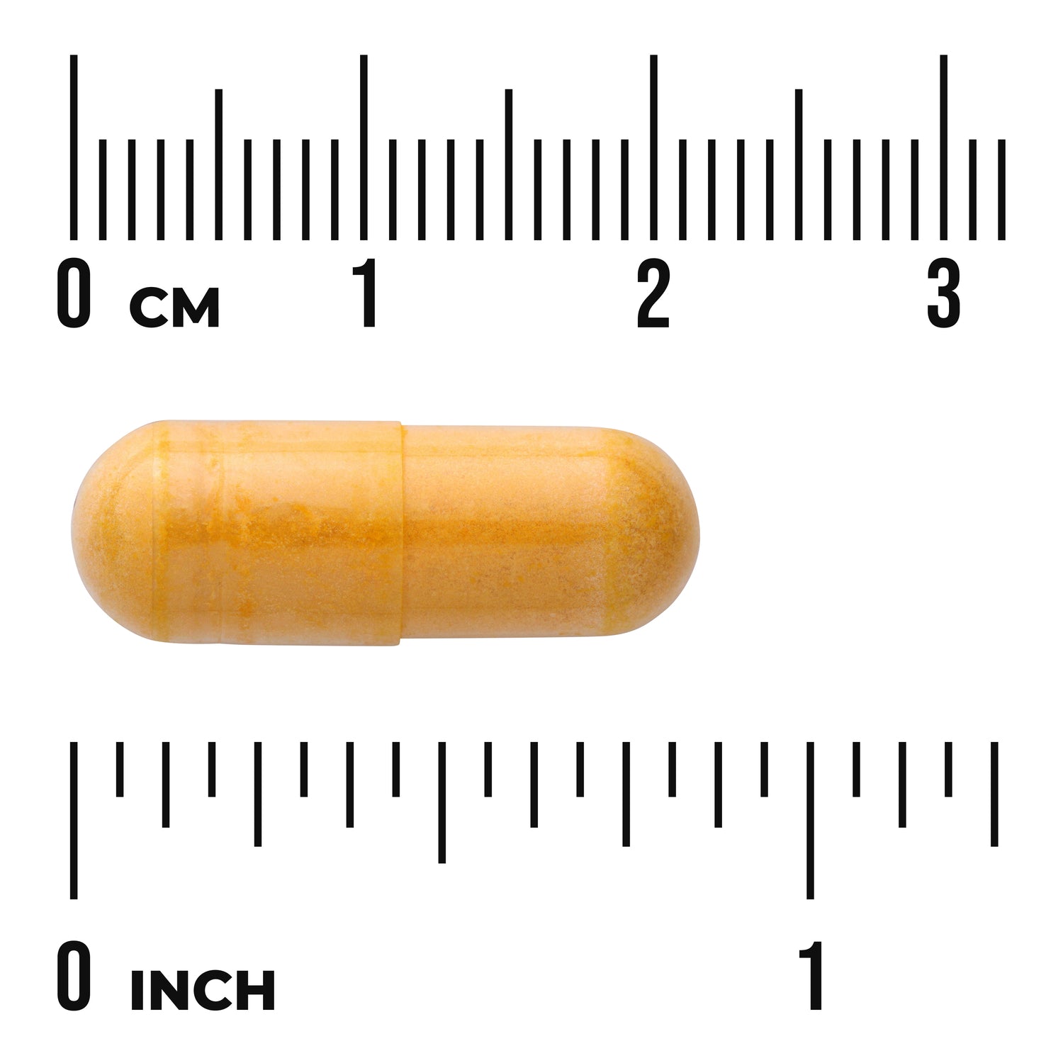 SW058 | Orange capsule shown next to centimeter and inch rulers, about 2.5 cm (1 in) long