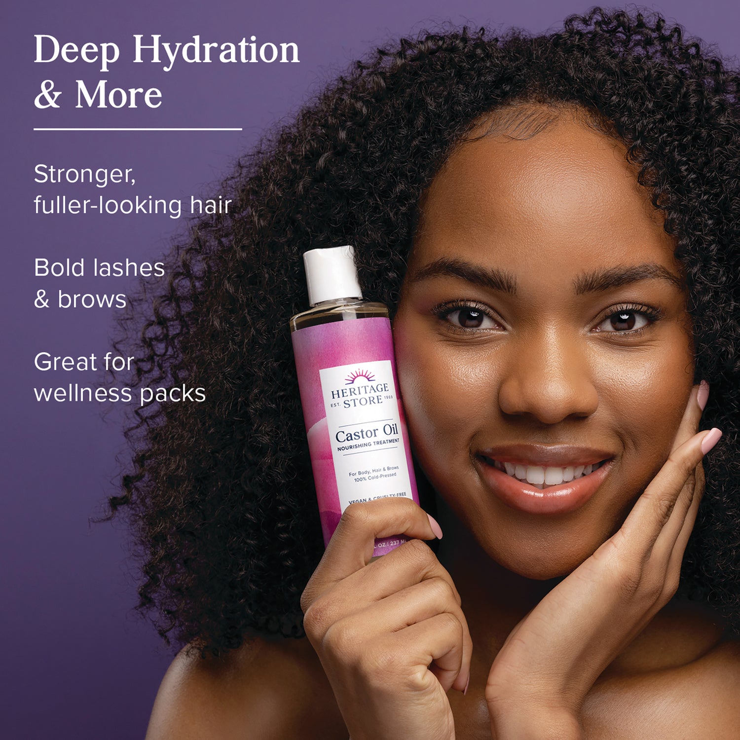 HTG007 | Woman holding Heritage Store castor oil bottle next to face with text Deep Hydration & More