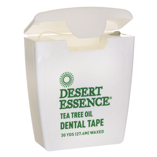 DST076 | white Desert Essence tea tree oil dental tape container with flip-top lid open, green logo and front label